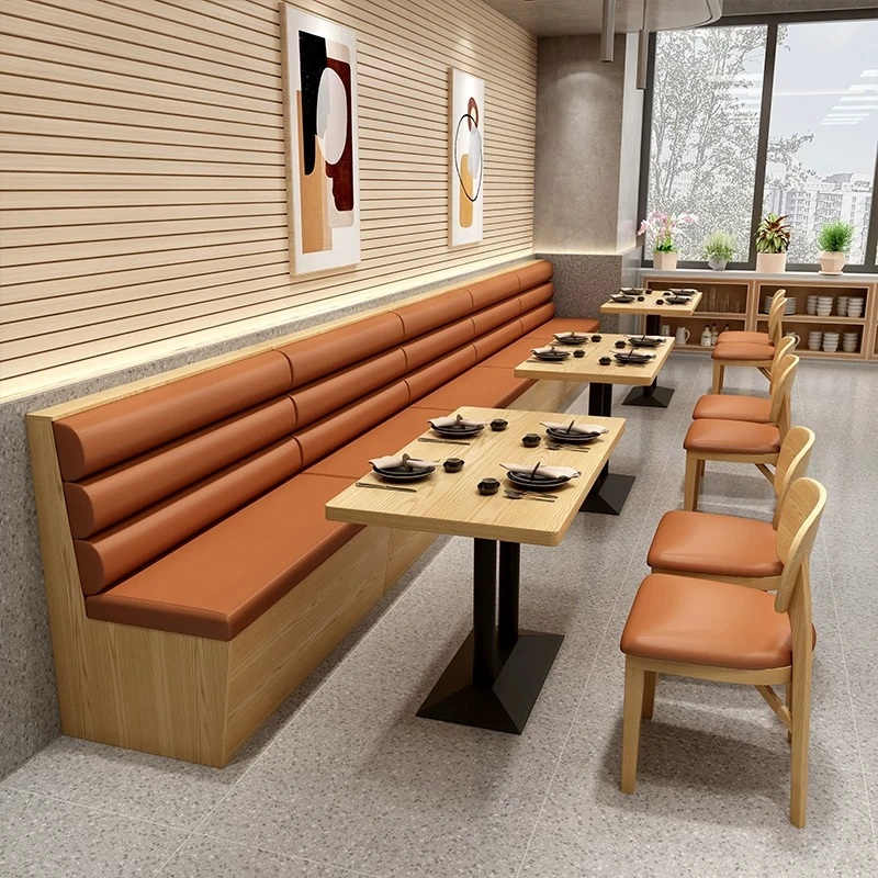 Custom restaurant furniture with dining tables, chairs, and booth seating for commercial dining spaces